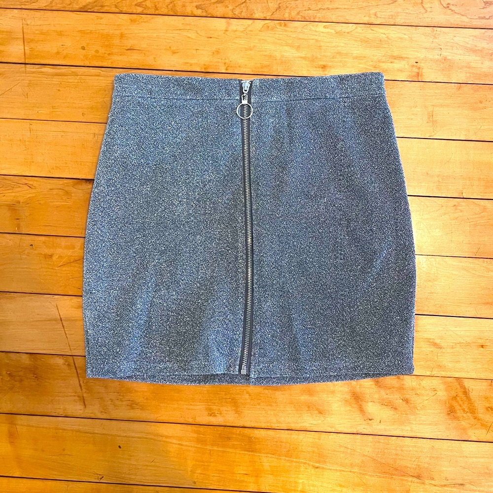 Sparkle skirt zip up the front. Tight and high waisted to belly button.